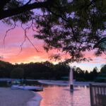 sunset with lake and fountain